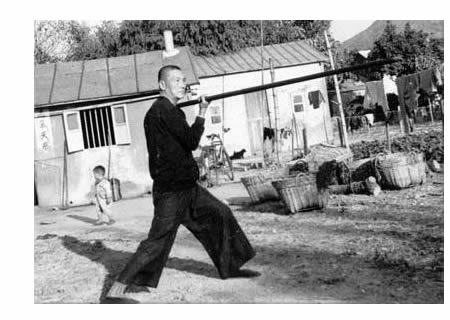 Cheung Lai Chuen with staff